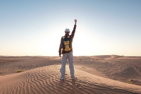 desert-adventure-young-man-with-backpack-walking-o-G44DHDE.jpg
